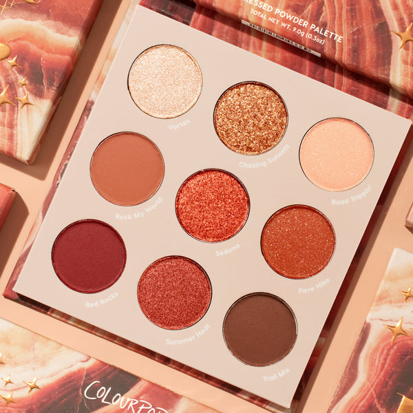 Rock On ColourPop Shadow Palette displaying nine warm, desert-inspired shades: Vortex, Chasing Sunsets, Road Trippin', Rock My World, Sedona, Fave Hike, Red Rocks, Summer Heat, Trail Mix, in matte and glitter finishes, set on peach marbled packaging.
