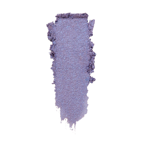 Rose Garden ColourPop Super Shock Shadow swatched in a single wide smear, a cool-toned lavender purple with icy blue sparkle and metallic sheen, showing soft, blendable texture on a white background.