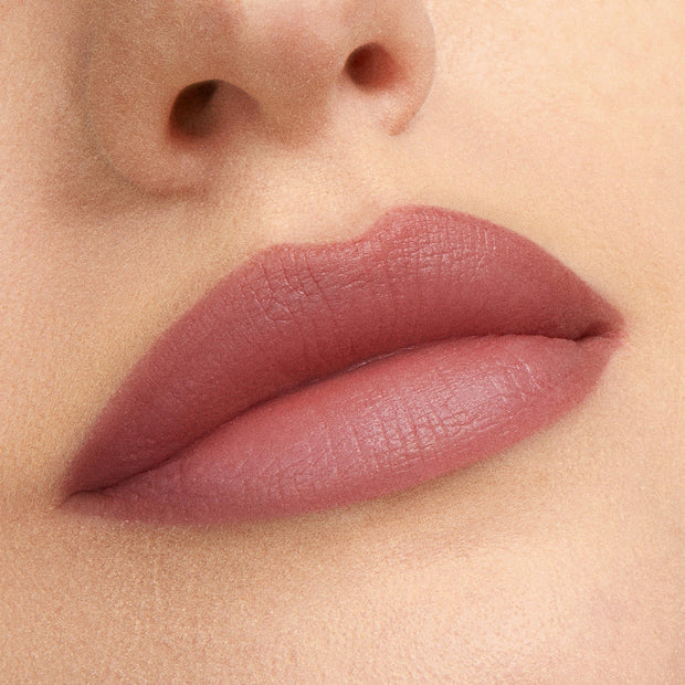 Rosy mauve lips wearing That’s So Rosy from the ColourPop Cheek & Lip Set, showing a soft-matte, blurred finish in a close-up studio shot that highlights smooth texture and full coverage.