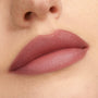 Rosy mauve lips wearing That’s So Rosy from the ColourPop Cheek & Lip Set, showing a soft-matte, blurred finish in a close-up studio shot that highlights smooth texture and full coverage.