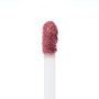 Doe-foot applicator swiping Rose Latte Ultra Blotted Lip, a rosy mauve-brown shade with a soft blurred finish, against a white background; ColourPop Ultra Blotted Lip macro highlighting plush bristles and creamy texture.