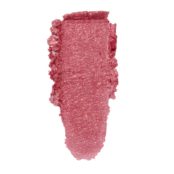Roy G. Biv ColourPop Super Shock Shadow swatched in a single thick swipe, showing a metallic rose‑pink shimmer with fine sparkle and creamy texture on a white background.