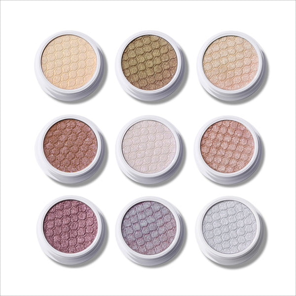 Sweet Sips Full Collection Set Super Shock Shadow compacts arranged in a 3x3 grid, showcasing nine shimmery honeycomb-pressed eyeshadows in champagne, bronze, taupe, mauve, and icy silver tones on a clean white background.