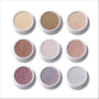 Sweet Sips Full Collection Set Super Shock Shadow compacts arranged in a 3x3 grid, showcasing nine shimmery honeycomb-pressed eyeshadows in champagne, bronze, taupe, mauve, and icy silver tones on a clean white background.