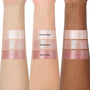 Three arms in different skin tones display the Sweet Sips full collection set of Super Shock Shadow swatches, showing shimmery shades Extra Sweet, Bobaholic, and Hey Cutea in metallic pink and champagne hues for comparison across skin tones.