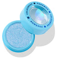 Open ColourPop Super Shock Shadow Hydro Pump shows a shimmering icy blue cream eyeshadow in an aqua round pot, with a matching cap printed COLOURPOP x POKÉMON and a holographic water droplet icon, set on a white background.
