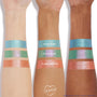 Flamethrower ColourPop Super Shock Shadow swatched in wide stripes on three arms, showing a metallic copper-orange shimmer; placed below Hydro Pump (aqua) and Solar Beam (green‑lavender) to compare pigment and sparkle across light to deep skin tones.