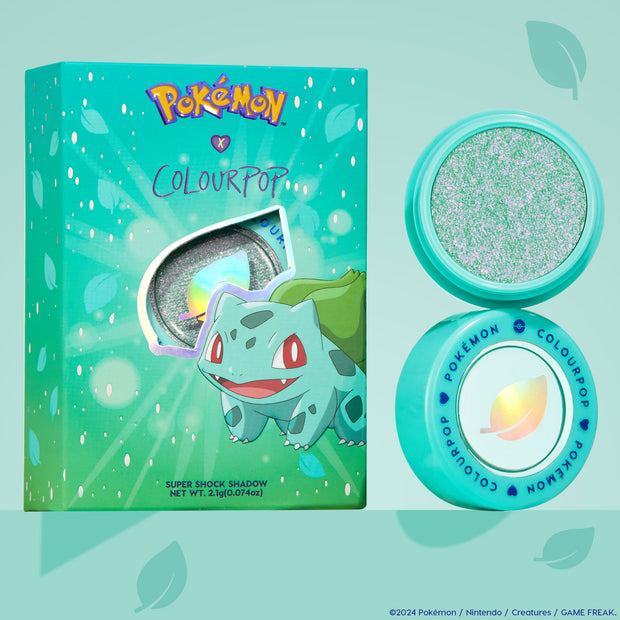 ColourPop Super Shock Shadow Solar Beam glimmers with mint-green and pink iridescent sparkle in an aqua pot, shown open beside its Pokemon x ColourPop Bulbasaur box on a teal backdrop, highlighting the leaf logo and collectible packaging.