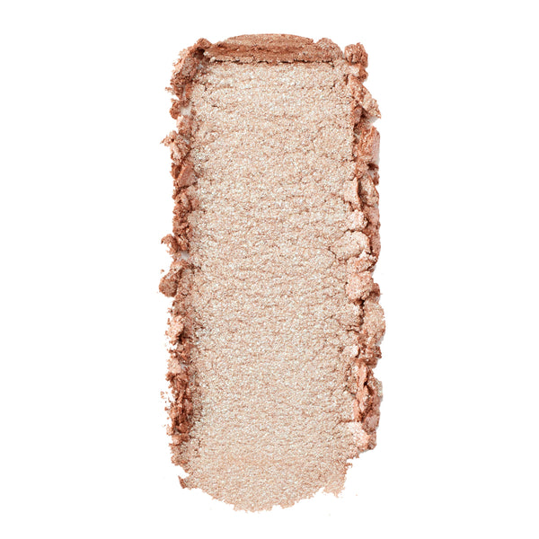 Sailor Super Shock Shadow by ColourPop swatched in a single rectangular swipe - shimmery champagne‑beige eyeshadow with fine silver sparkle and soft, creamy texture - shown with slightly crumbled edges on a white background.