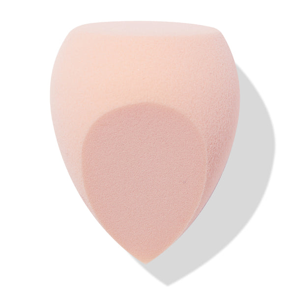 Blush-pink Sculpting Sponge blending foundation and contour with a flat top, rounded sides, and a pointed precision tip, shown angled on a white backdrop with soft shadow; ColourPop Makeup Tools & Accessories for seamless application.