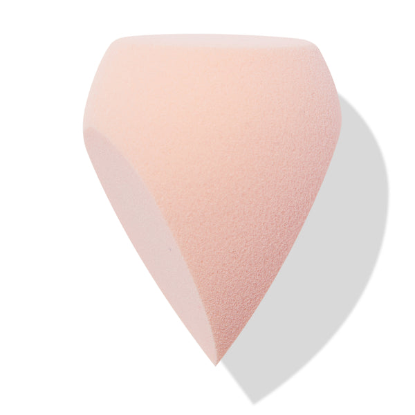 Blush-pink Sculpting Sponge featuring an angled flat edge and pointed tip for blending and contouring, set against a white background; a teardrop makeup tool in ColourPop Makeup Tools & Accessories.