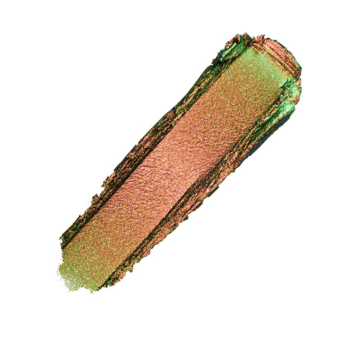 ColourPop Shadow Stix “It’s Always Been Him” swatched in a thick diagonal swipe, showing a metallic duochrome copper-rose base with a vivid green shift and fine shimmer on a white background.