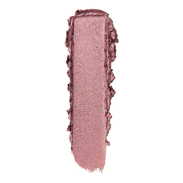 Metallic rose-mauve eyeshadow swatch smeared in a single vertical swipe with textured edges on a white background, showcasing the Next Spot ColourPop Shadow Stix - creamy stick shadow with fine shimmer.