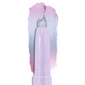 Colourpop Cotton Candy Shadow Stix crayon tip gliding upward, leaving a shimmering pastel lavender-to-pink duochrome eyeshadow swatch on a clean white background, showing smooth, blendable cream texture.