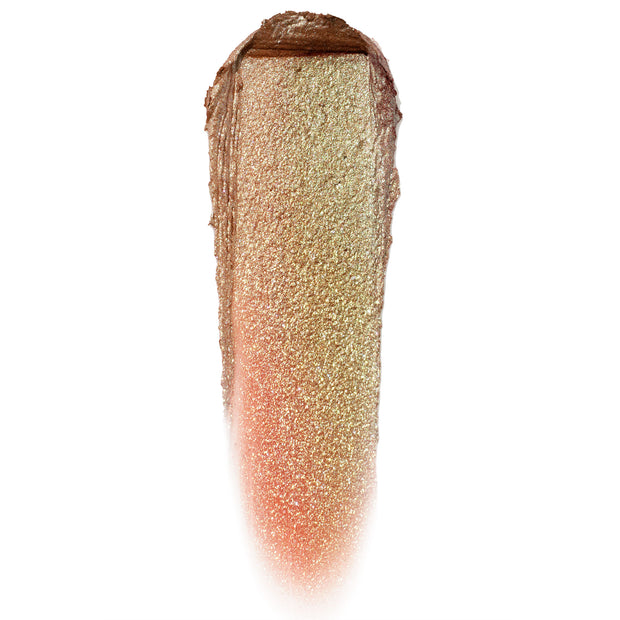 Shiny Penny Jelly Much Shadow swatch gleams in a vertical swipe, shifting from coppery bronze to peach with dense gold sparkle, showcasing the wet metallic finish of the ColourPop Jelly Much Shadow on a clean white background.