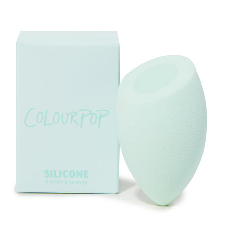 Silicone Blending Sponge standing upright beside a mint ColourPop box, teardrop design with flat top for precise foundation and concealer blending; a ColourPop Makeup Tools & Accessories essential for smooth, streak-free application.