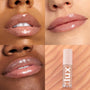 ColourPop Lux Lip Oil Skinny Dip coating lips with a sheer nude shine across three close-up swatches, while the pink-capped “lux” tube rests on a swirled peach backdrop, showcasing a hydrating, non-sticky finish.