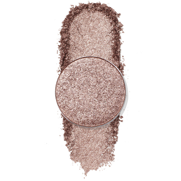 ColourPop Snake Eyes Pressed Powder Shadow shown with a circular pan over a vertical swatch on white, featuring a metallic rose‑taupe shimmer and glittery finish that highlights texture, pigment, and sparkle.