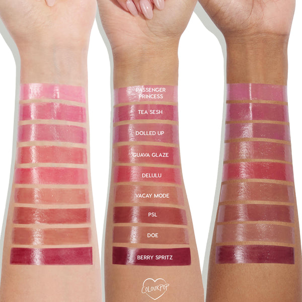 Passenger Princess swatch glows at the top of three-arm swatch rows, showing the pink, high-shine finish of the ColourPop So Juicy Plumping Gloss Balm with Peptides across light, medium, and deep skin tones; center column labels each shade.