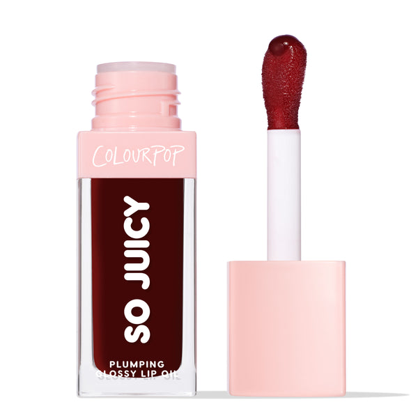 ColourPop So Juicy Plumping Glossy Lip Oil in Beverly Drive stands with cap off, showing a doe-foot applicator loaded with deep burgundy gloss; clear rectangular tube with pink cap and SO JUICY branding on a clean white background.