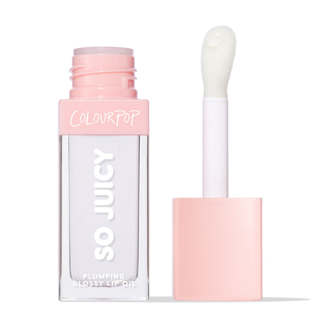 ColourPop So Juicy Plumping Glossy Lip Oil in Lychee Jelly shown open, clear square tube with blush‑pink cap and COLOURPOP branding, doe‑foot applicator holding a translucent gloss bead against a white studio background.
