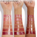 Glossy arm swatches showcase She's So Juicy, the ColourPop So Juicy Plumping Gloss Balm with Peptides, featuring six high-shine shades - Dolled Up, Guava Glaze, Vacay Mode, Doe, PSL, and Berry Spritz - on three forearms of different skin tones.