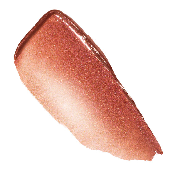 Shimmering swipe of Perfection, a warm peachy nude with fine gold sparkle, showing the glossy texture of the ColourPop So Juicy Plumping Gloss Balm with Peptides, smeared diagonally on a white background.