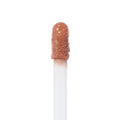 Doe-foot wand saturated with Starling Ultra Blotted Lip in a peachy nude, standing upright against a white background; ColourPop Ultra Blotted Lip applicator shown in macro, highlighting the velvety, blotted texture.