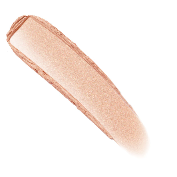 Sunlight Lite Stix cream highlighter swatch forming a smooth, pearly champagne-peach streak against a white background, showcasing the glow and blendable texture of the ColourPop Lite Stix.
