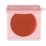 ColourPop Cream Blush Sunset Strip rests in a half-closed pink square compact, exposing a smooth warm terracotta pan with white star accents, studio product shot on a white background.