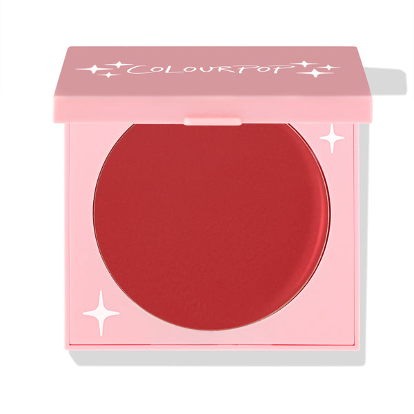 TTYL ColourPop Cream Blush in a half-closed pink compact, showcasing a large round pan of matte warm terracotta-red with star accents and the ColourPop logo on the lid, set against a white background.