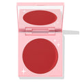 TTYL ColourPop Cream Blush compact revealing a matte deep coral-red pan and mirror, shown half-open in a pastel pink case with white star accents on a clean white background.