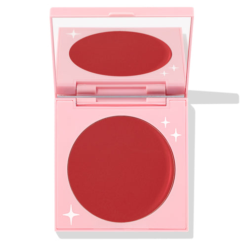 TTYL ColourPop Cream Blush compact revealing a matte deep coral-red pan and mirror, shown half-open in a pastel pink case with white star accents on a clean white background.