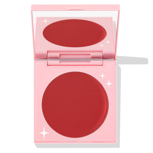 TTYL ColourPop Cream Blush compact revealing a matte deep coral-red pan and mirror, shown half-open in a pastel pink case with white star accents on a clean white background.