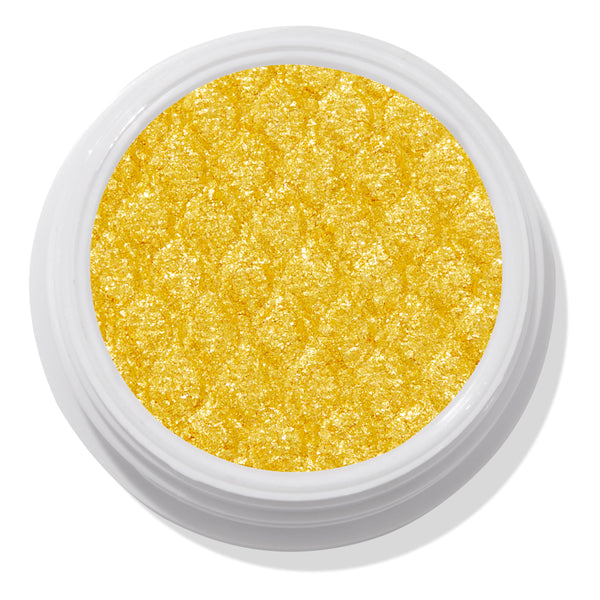 ColourPop Super Shock Shadow Tankini shows a vibrant metallic yellow‑gold pan sparkling with a quilted, bouncy texture, sitting open in a white jar against a clean white studio background.