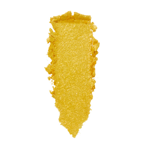 Metallic golden-yellow eyeshadow swatch smeared in a vertical stripe, highlighting a creamy, sparkly texture - ColourPop Tankini Super Shock Shadow - on a clean white studio background.
