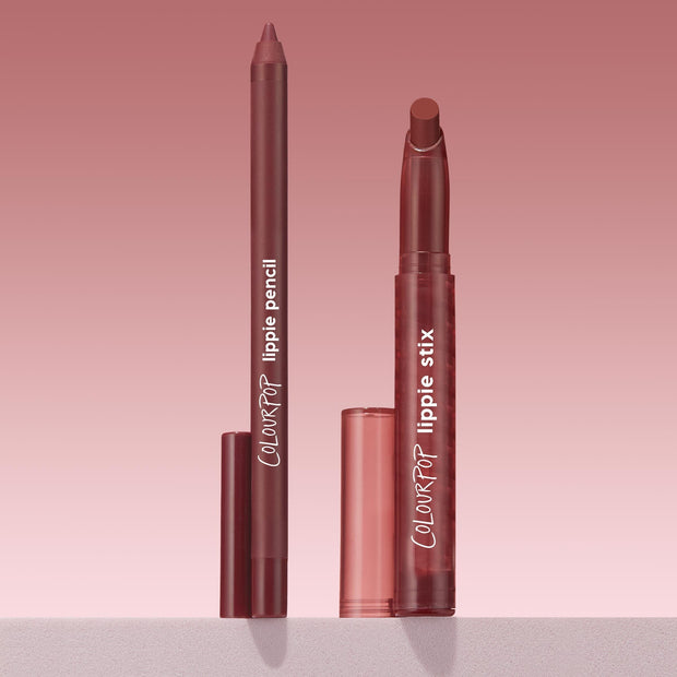 ColourPop Lippie Stix + Pencil Set Pucker Up standing upright, twist-up mauve Lippie Stix and matching lip pencil uncapped with translucent rose caps beside, ColourPop logos visible, on a soft pink gradient backdrop atop a light shelf.