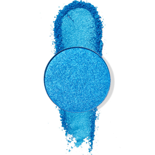 Round Tide Pool ColourPop Pressed Powder Shadow pan displays vibrant metallic ocean‑blue pigment, with a thick swipe of the shimmery powder dragged vertically beneath the pan on a white background.