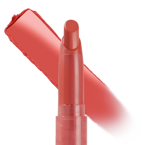 Topanga shade ColourPop Lippie Stix stands uncapped, showing a rosy coral bullet with a thick swipe of creamy pigment behind it, highlighting smooth, full-coverage payoff on a clean white background.