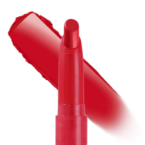Trust Me Lippie Stix by ColourPop, a bold true-red matte lipstick crayon, extends its twist-up bullet while a thick swatch streak sweeps behind on a white studio background, showing creamy payoff and precise application - ColourPop Lippie Stix.