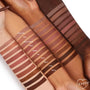 ColourPop Lippie Pencil BFF2 swatched on multiple arms, showing the warm brown liner band labeled “BFF2” among other nude shades; neat horizontal stripes highlight smooth, pigmented color payoff across varied skin tones.