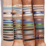 Four arms of different skin tones display swatches of the Twilight x ColourPop Full Collection set, showing shimmery and matte eyeshadow and liner shades with names like Edward, The Cullens, and Forever Young in cool neutrals, blues, greens, and silvers.