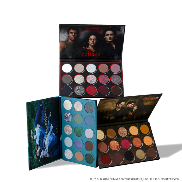 Twilight Forever palette trio displayed open, showing three Twilight-themed ColourPop eyeshadow palettes with rows of shimmery silvers, bold reds, earthy browns, greens, and blues, each compact featuring iconic Twilight movie artwork on the covers.