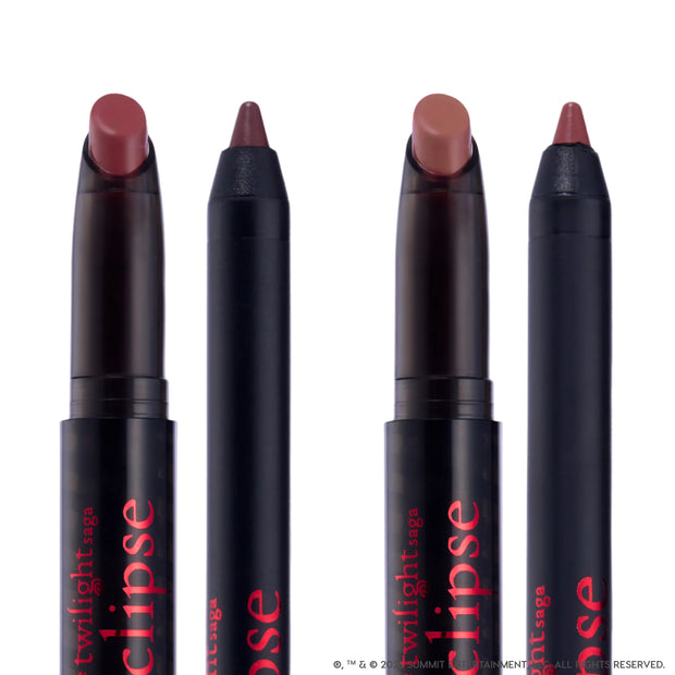 Immortal Kiss Lippie Stix Duo from the Twilight collection standing upright against a white background, showing two creamy mauve-brown lipstick crayons and two matching liners in sleek black tubes with red Eclipse branding.