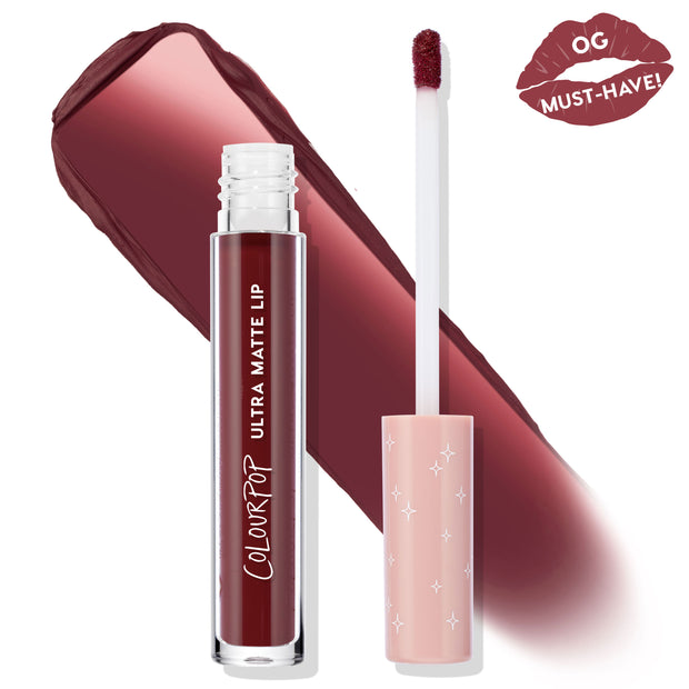 ColourPop LAX Ultra Matte Lip liquid lipstick stands open with a doe-foot applicator beside a rich vampy burgundy swatch; clear tube reads Ultra Matte Lip, pink cap has white stars, and an “OG Must-Have!” lip badge appears in the corner.