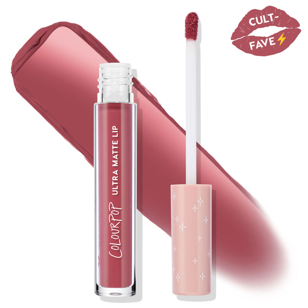 ColourPop Ultra Matte Lip in Flurries, open tube with doe‑foot applicator loaded with rosy mauve pigment, set over a broad swatch and a cult‑fave kiss graphic, highlighting the matte liquid lipstick shade.