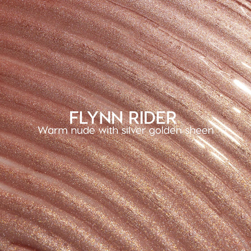 Flynn Rider Ultra Glossy Lip swatch shows a warm nude gloss with silver‑gold shimmer, spread in wavy ripples for a high‑shine finish; close-up of the ColourPop Ultra Glossy Lip shade on a textured smear.