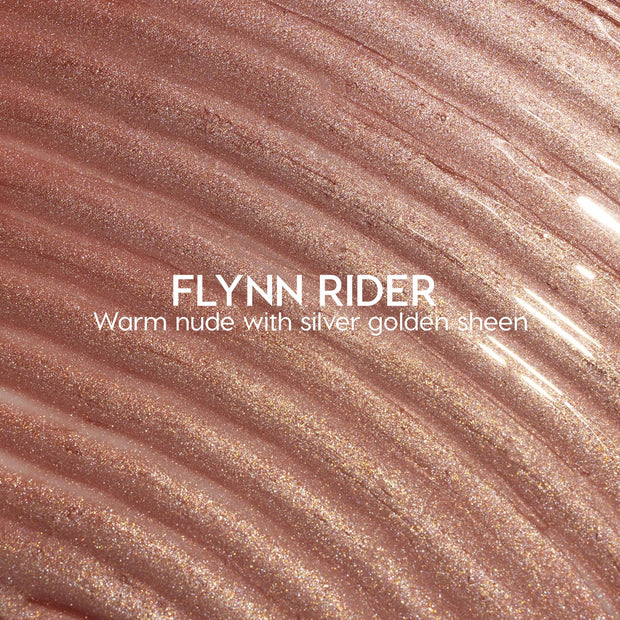 Flynn Rider Ultra Glossy Lip swatch shows a warm nude gloss with silver‑gold shimmer, spread in wavy ripples for a high‑shine finish; close-up of the ColourPop Ultra Glossy Lip shade on a textured smear.