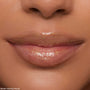 Lips wearing ColourPop Ultra Glossy Lip Pascal, catching studio light in a sheer, high-shine finish with fine iridescent shimmer; extreme close-up beauty shot emphasizing smooth, hydrated lips and glossy payoff.