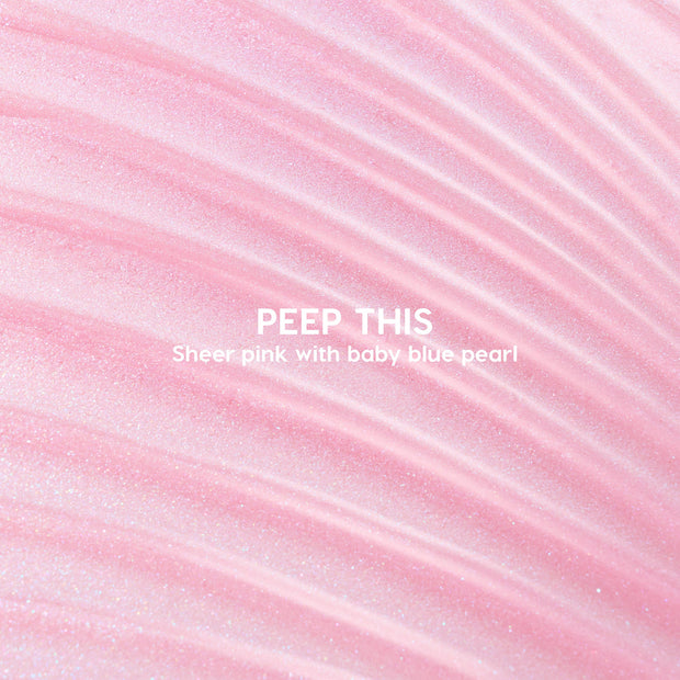 Peep This ColourPop Ultra Glossy Lip swatch showing sheer pink gloss with baby-blue pearl shimmer rippling in curved streaks, with the product name centered in white type.